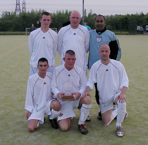The winners. Back rows shows David Raeper, Mark Muers and Davinder Sangha. Front shows Titch Conlon, Paul Stokoe (with the trophy) and Neil Richardson.