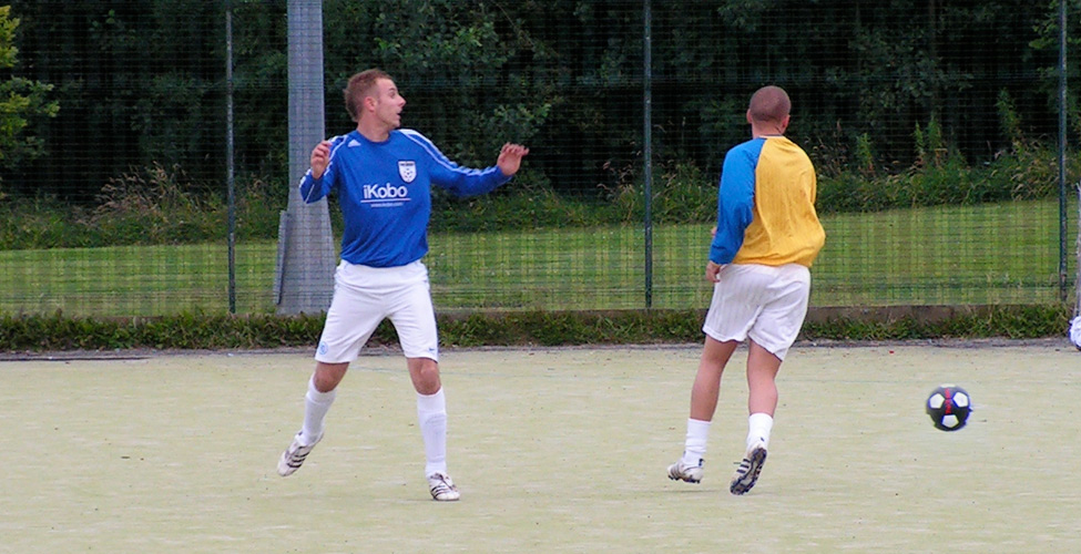 Siddall for Wear (wearing blue) watches the agile Kyle Robinson dance away with the ball.