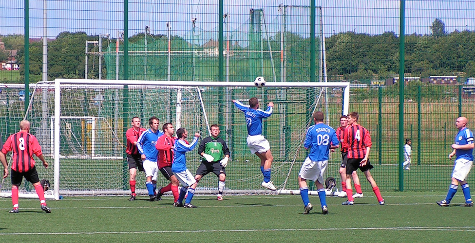 Action Man, Dave Graham goes in for a header.
