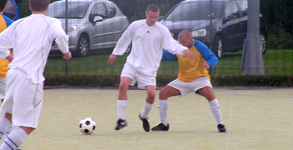 Kurt Baxendale holds off Grant Foster in Fusion's 1-1 draw against WWC. Baxendale got the equaliser for Fusion.