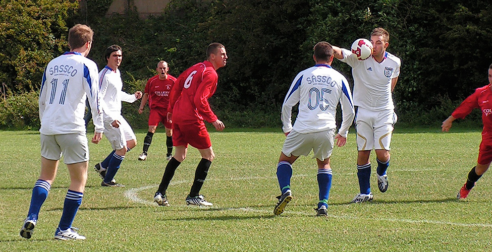 Campbell chins the ball, while watched by Dixon, Greenwell and Pearson.
