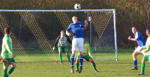 Simpson leaps for the ball in his outfield role.