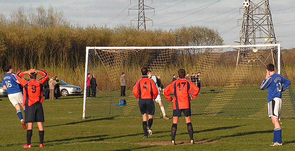 Stoker steps up and cannons his penalty off the crossbar and on to the next pitch.