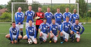 The team pictured in the new shirts.